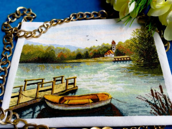 il_fullxfull.3047048896_lh0e Summer lake cross stitch design with a wooden pier, a small boat, and calm nature colors without a frame.