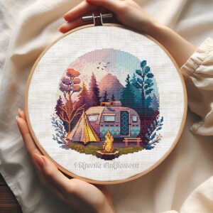 Camping cross stitch pattern in a hoop featuring a summer mountain landscape with camper, tent and bonfire