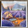finished embroidery of a lavender camping scene with a tent, bicycle and mountains
