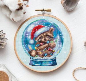 Snow Globe Raccoon cross stitch pattern with a winter woodland raccoon in a glass snow globe, hand‑drawn PDF.
