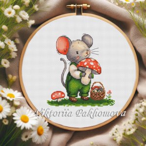 Cottagecore baby mouse with red amanita mushroom cross stitch pattern in a wooden hoop, surrounded by daisies and sewing threads.
