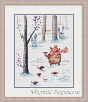 Teddy Bear and Bunny cross stitch in a wooden frame with winter woodland background and snowflakes
